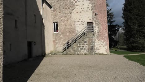 drum castle early spring morning lady climbs steps to tower