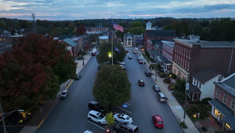 small town america square with american flag and historic buildings