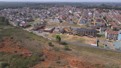 Modern-housing-estate-at-suburbs-of-Nairobi-capital-city-of-Kenya,-aerial-view