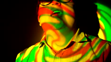 portrait of a fat man in the multicolored spotlight