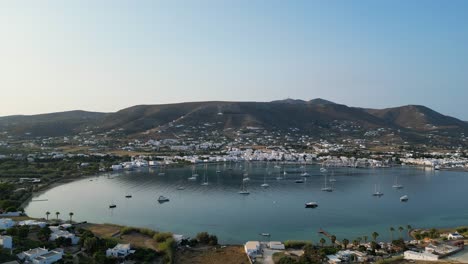 aerial footage of the town and port of parikia on the island of paros, one of the many cyclades islands in the aegean sea