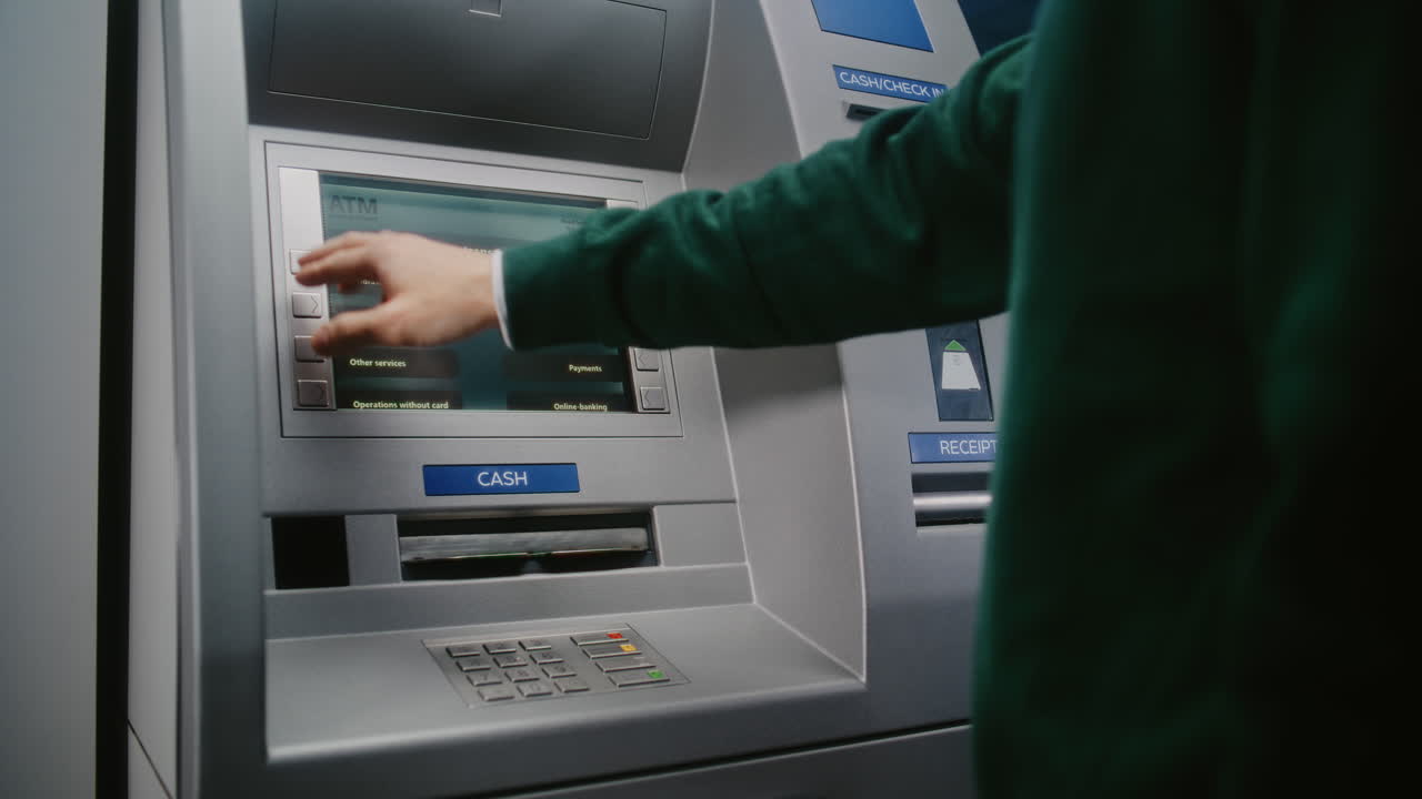 Unrecognizable Person Entering PIN Code on ATM Keypad to Withdraw Money. Error Message on Cash Machine Display About Transaction Cancellation Due to Incorrect PIN Code. Banking Equipment. Close Up.