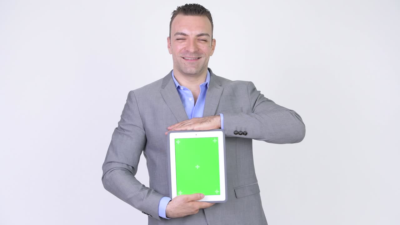 Businessman Making Presentation With Green Screen Tablet