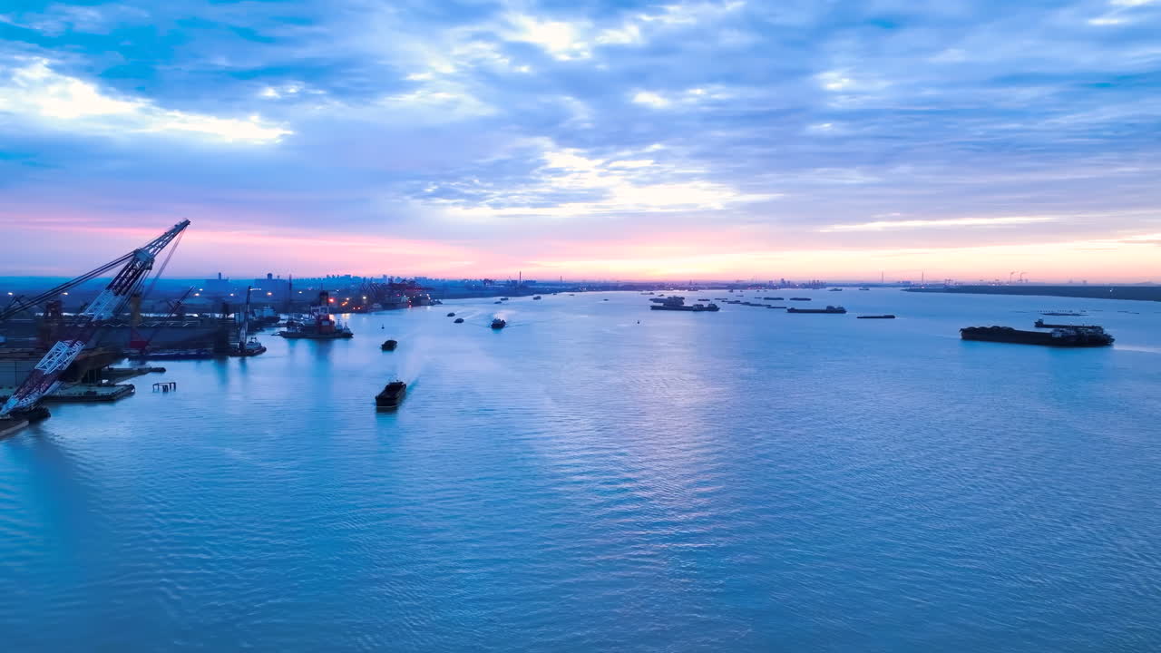 Sunrise view international trade, maritime transportation hubs. container ship import export business commercial port in deep sea load and unloading cargo by crane for distributing goods