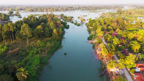 isolated river islands at sunrise surrounded by blue waters, serene and untouched beauty, 4,000 islands, si phan don, laos