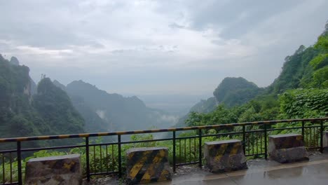 Bus-window-view-of-the-dangerous-winding-road-of-99-turns-to-the-top-of-the-Tianmen-Mountain,-Zhangjiajie-National-Park,-Hunan,-China