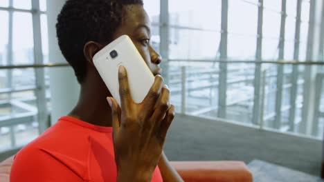 Businesswoman-talking-on-the-phone-in-office-4k