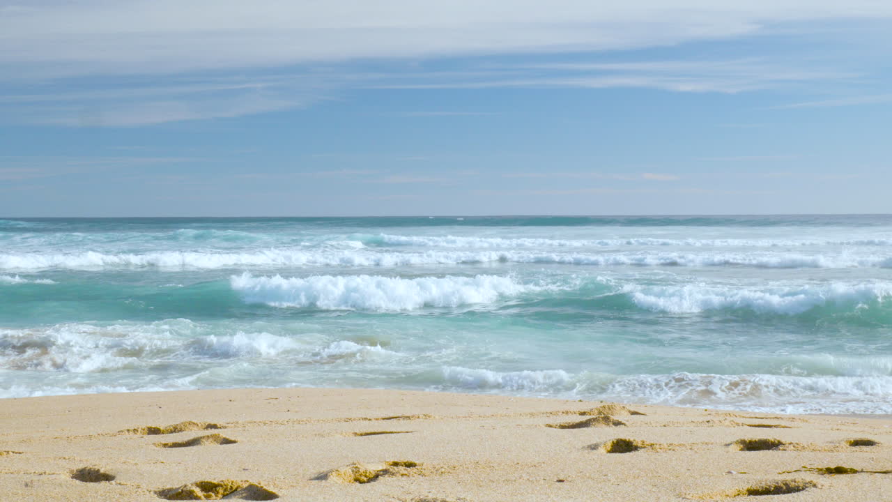 Popular tourist destination, footprints in the sand at beautiful beach