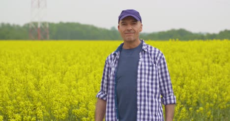 Farmer-Examining-Agriculture-Field-On-Farm-9