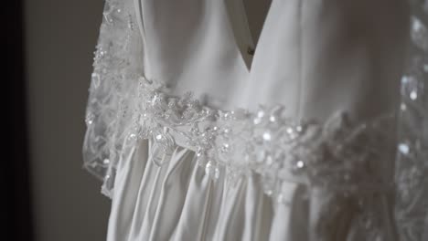close up of a delicate wedding dress with intricate lace details