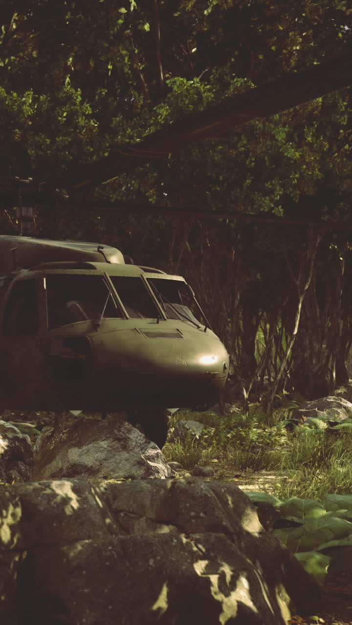 Helicopter navigates dense forest during a mission at dusk