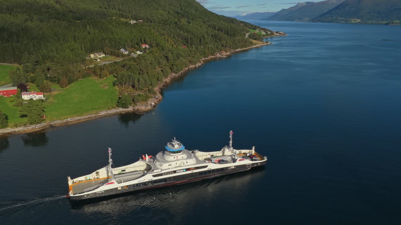 High angle capture of car ferry setting off from Norway harbor