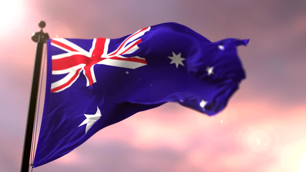 Flag of Australia waving at wind at sunset, loop