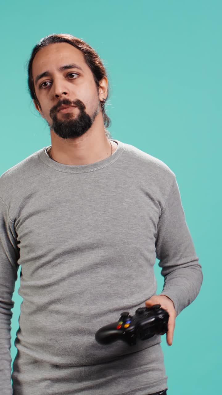 Vertical video Portrait of gamer annoyed after losing online multiplayer videogame
