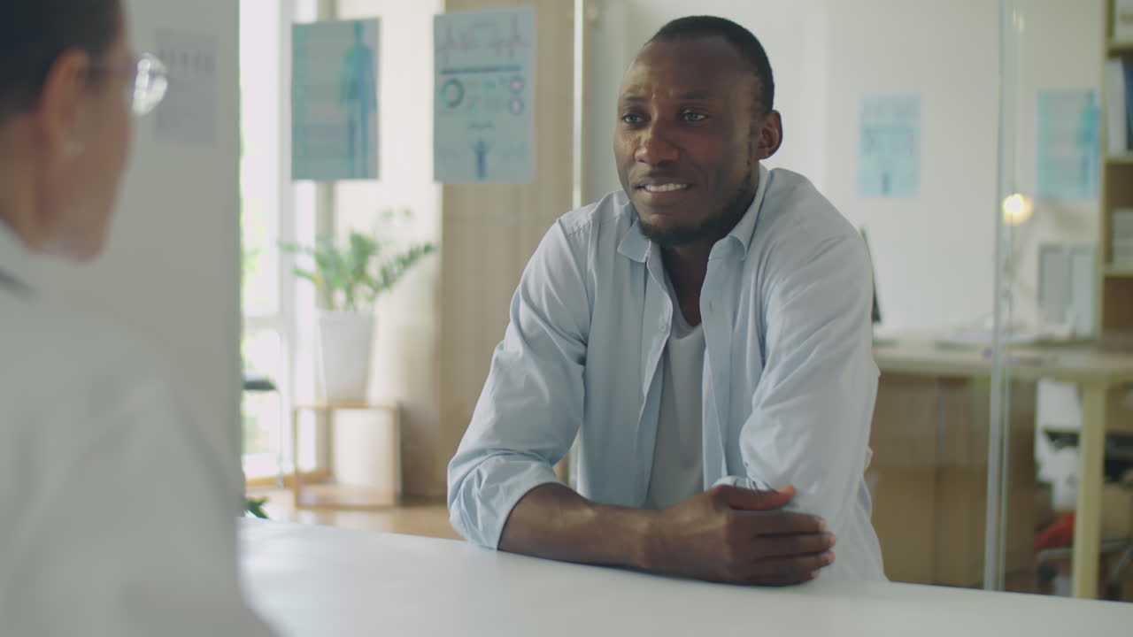 African American Man Visiting Doctor in Clinic
