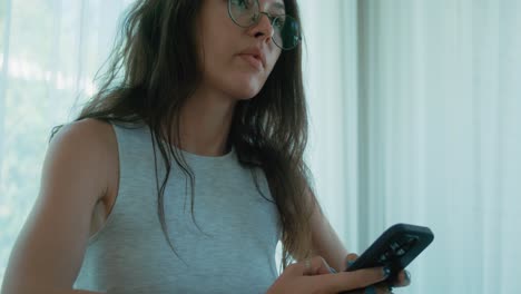 woman using phone and looking away