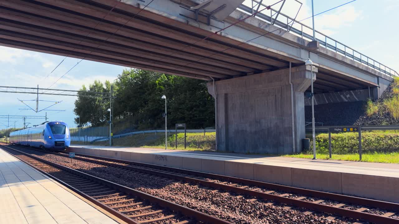 Purple train arriving at the train station