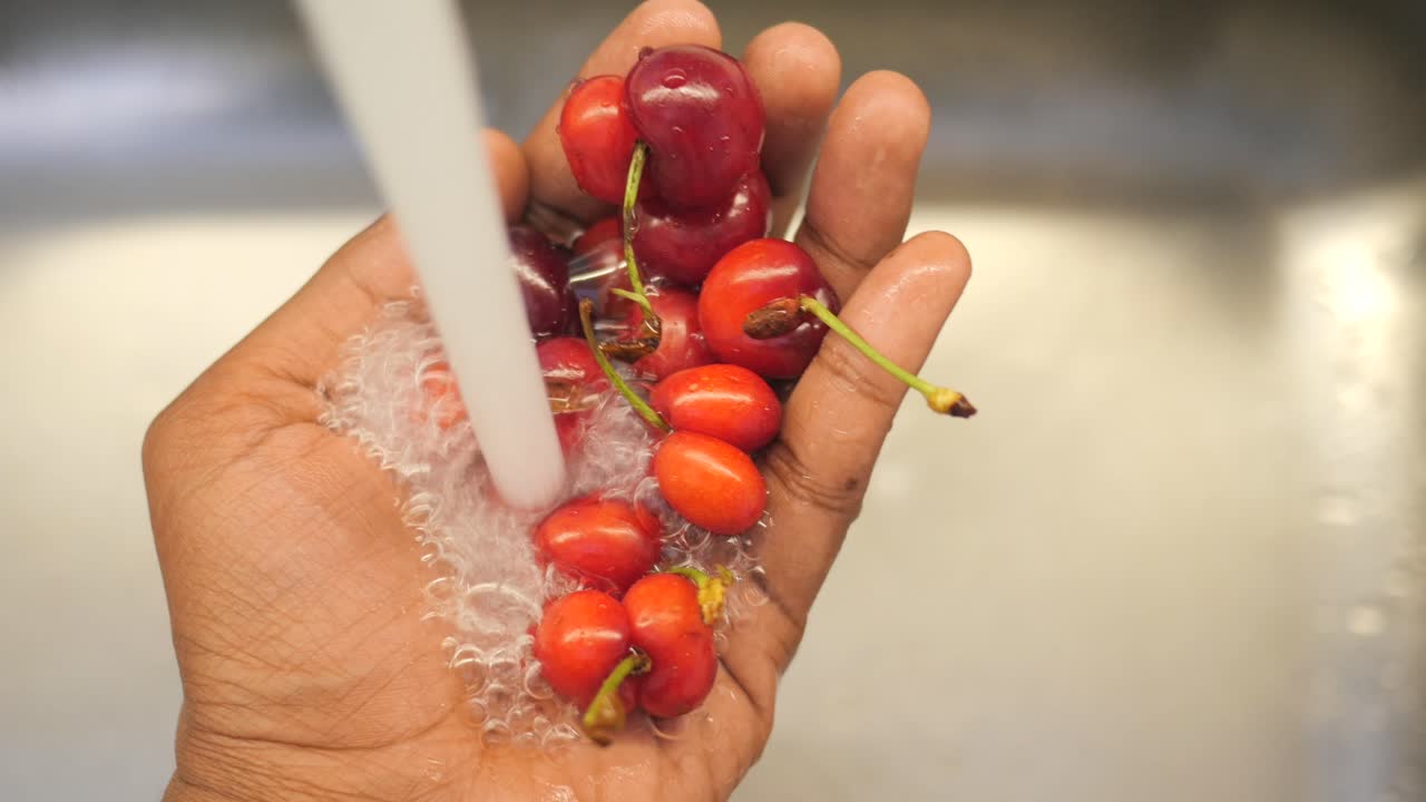 Washing Cherries Under a Tap