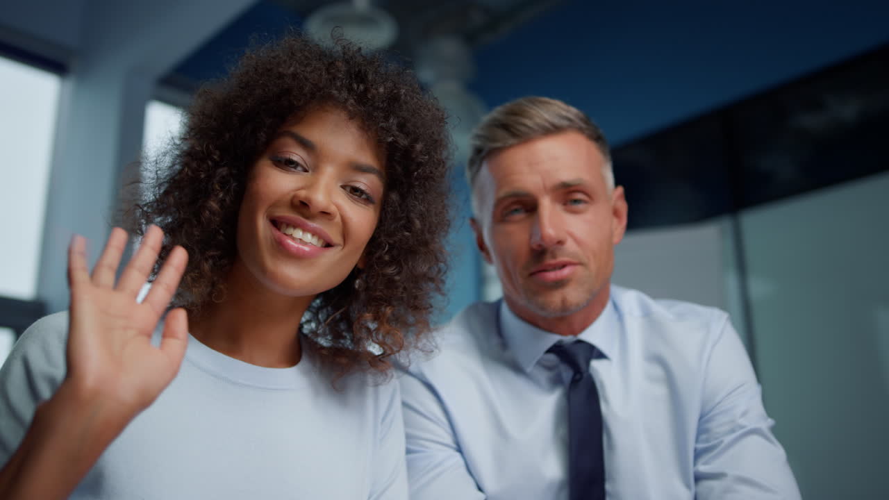 Multiethnic colleagues discussing business plans with partners