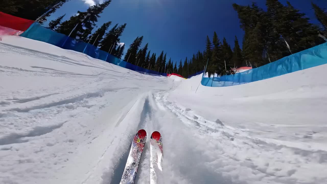 POV video of skiing down a snowy slope, capturing the dynamic movement and thrill