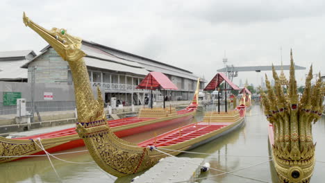 golden royal thai barges on display at the national museum, located near the banks of vhaor phraya river in bangkok, thailand