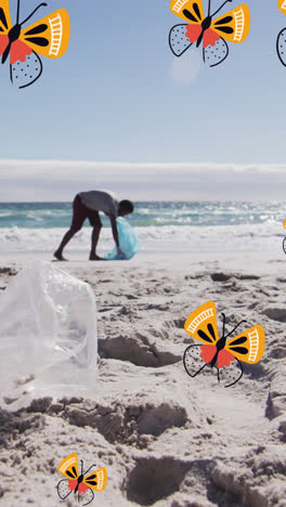 Animation-of-butterflies-over-african-american-man-and-woman-picking-up-rubbish-on-beach