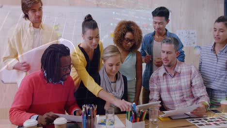 business executives are interacting with each other during a meeting in a conference room