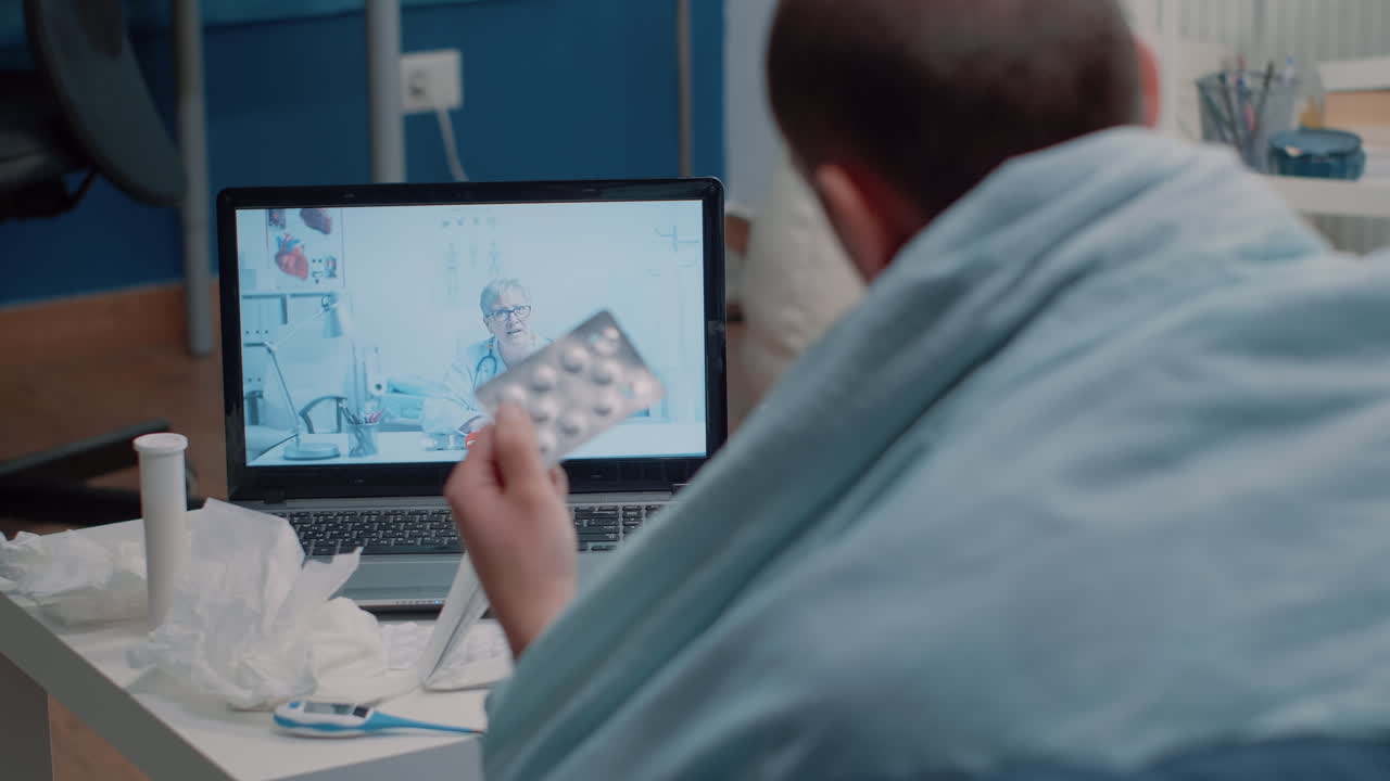 Man architect working with laptop and building model to design construction plan