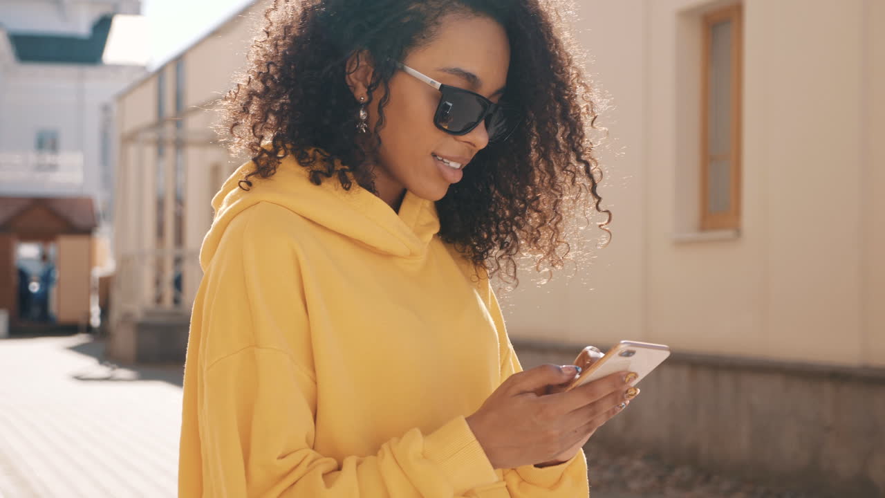 Woman using smartphone in city