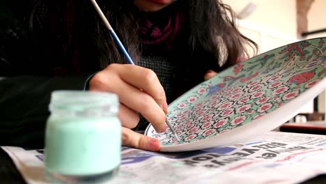 artist painting hand made ottoman tile porcelain motifs