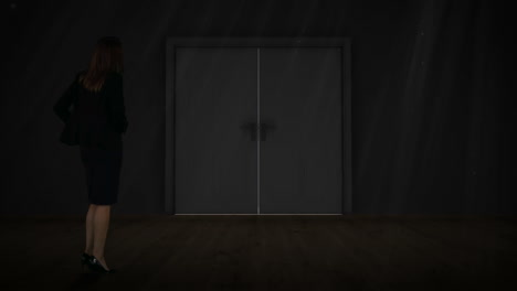 Businesswoman watching door open to light