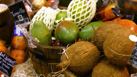 close-up of coconut and other fruits in organic section