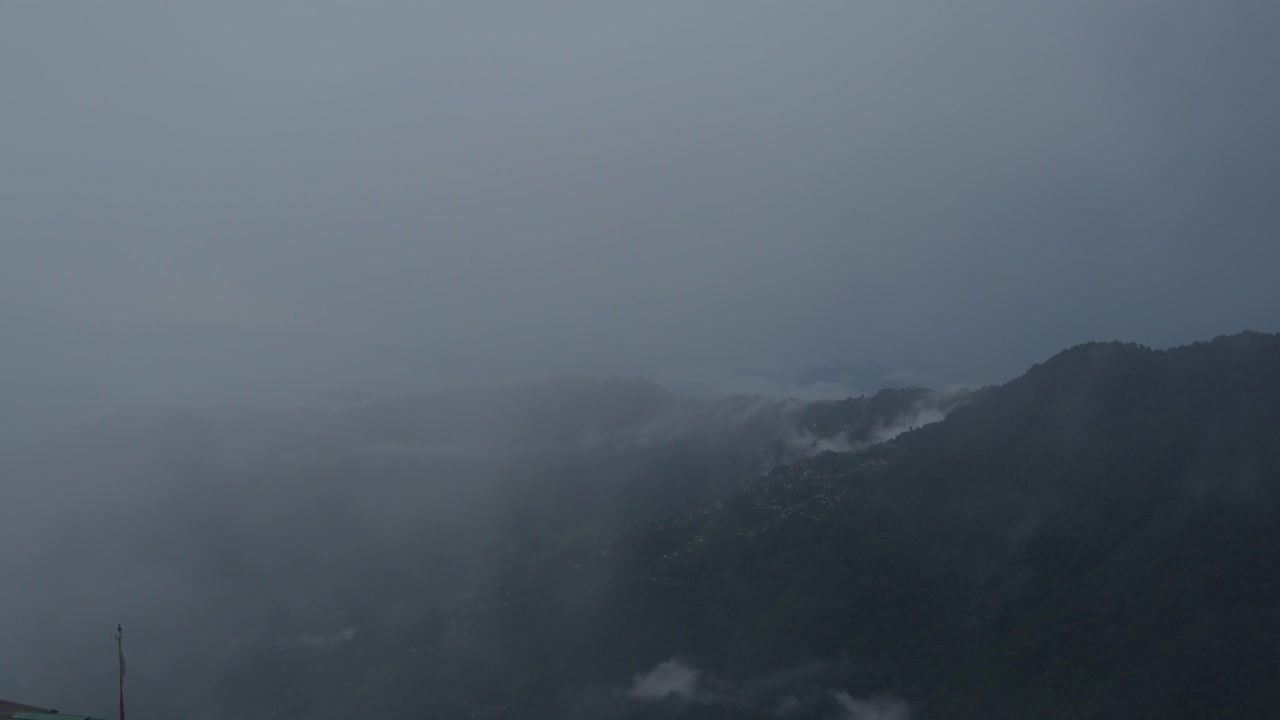 The mountain is covered in clouds during the rainy season