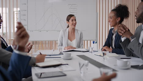 beautiful business woman team leader meeting with colleagues sharing creative ideas for startup project discussing corporate strategy in office boardroom