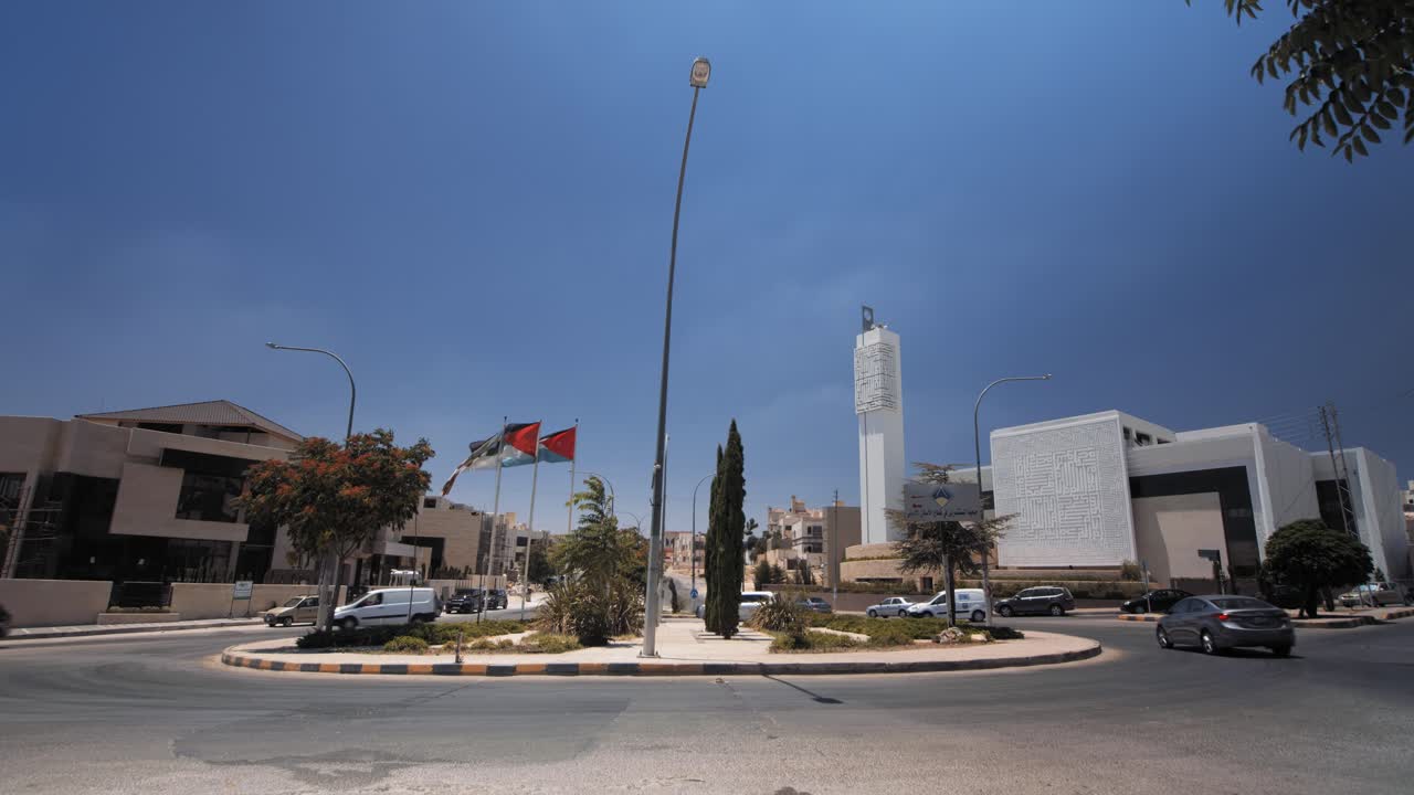 Nice view in West Amman , Jordan. Wide shot for a roundabout with traffic and modern mosque. 4K