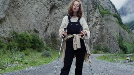 teenage girl hiking in a mountain valley