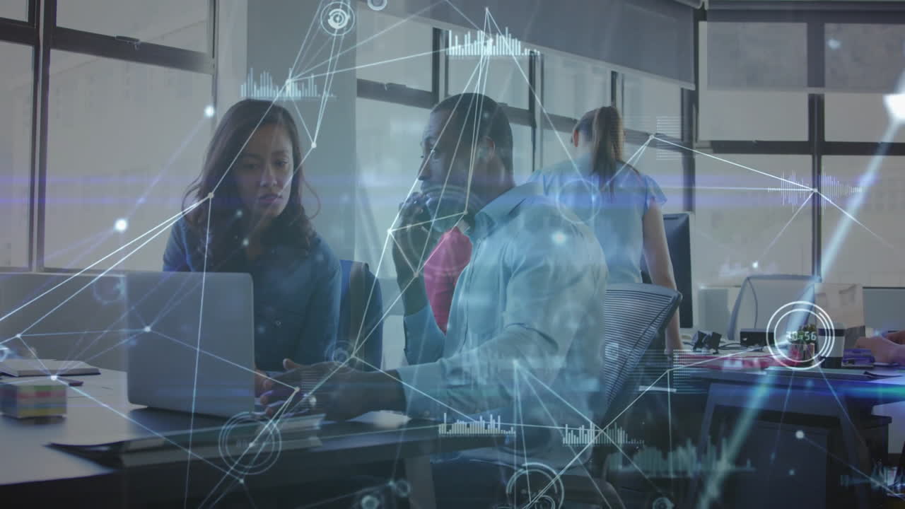 Business professionals working at office with data processing animation overlay