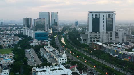 aerial skyline view of modern buildings in pik jakarta at sunset