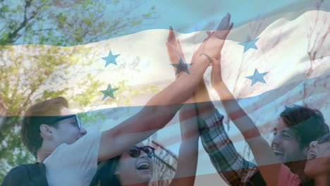 celebrating outdoors, friends with honduras flag animation overlay in background