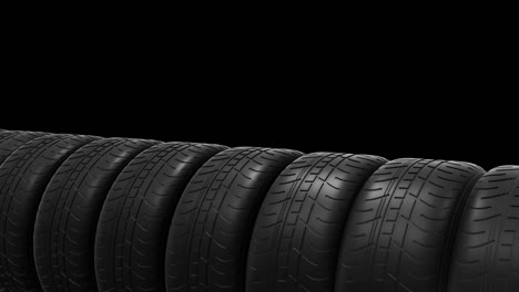 row of black tires on black background