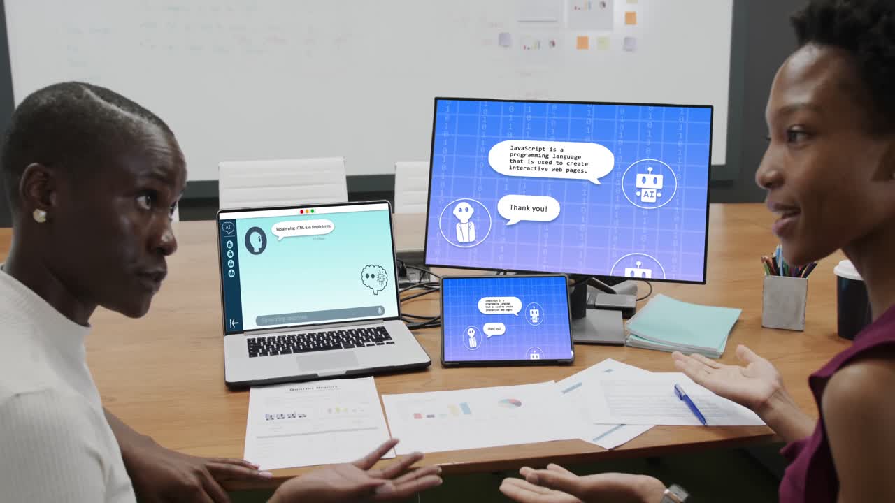 African american businesswomen using computer with data processing in office