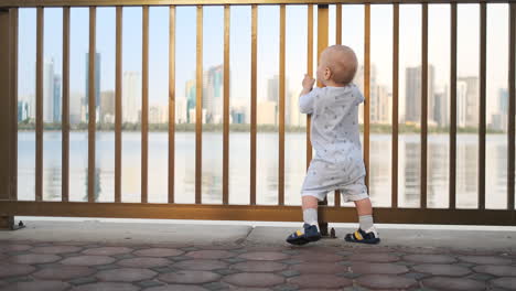 laughing boy at the age of 1 year dancing.