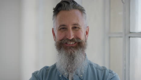 portrait-of-senior-caucasian-man-smiling-happy-looking-at-camera-enjoying-successful-lifestyle-happy-mature-male-with-stylish-beard