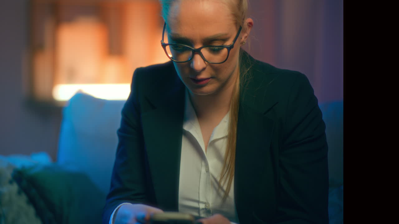 Close Up Of Woman Browsing Social Media Late In The Evening