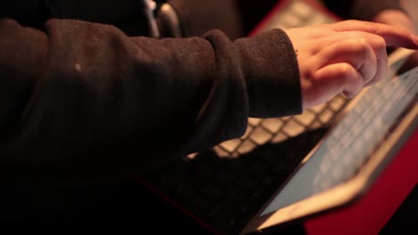 girl's hand browsing on a tablet