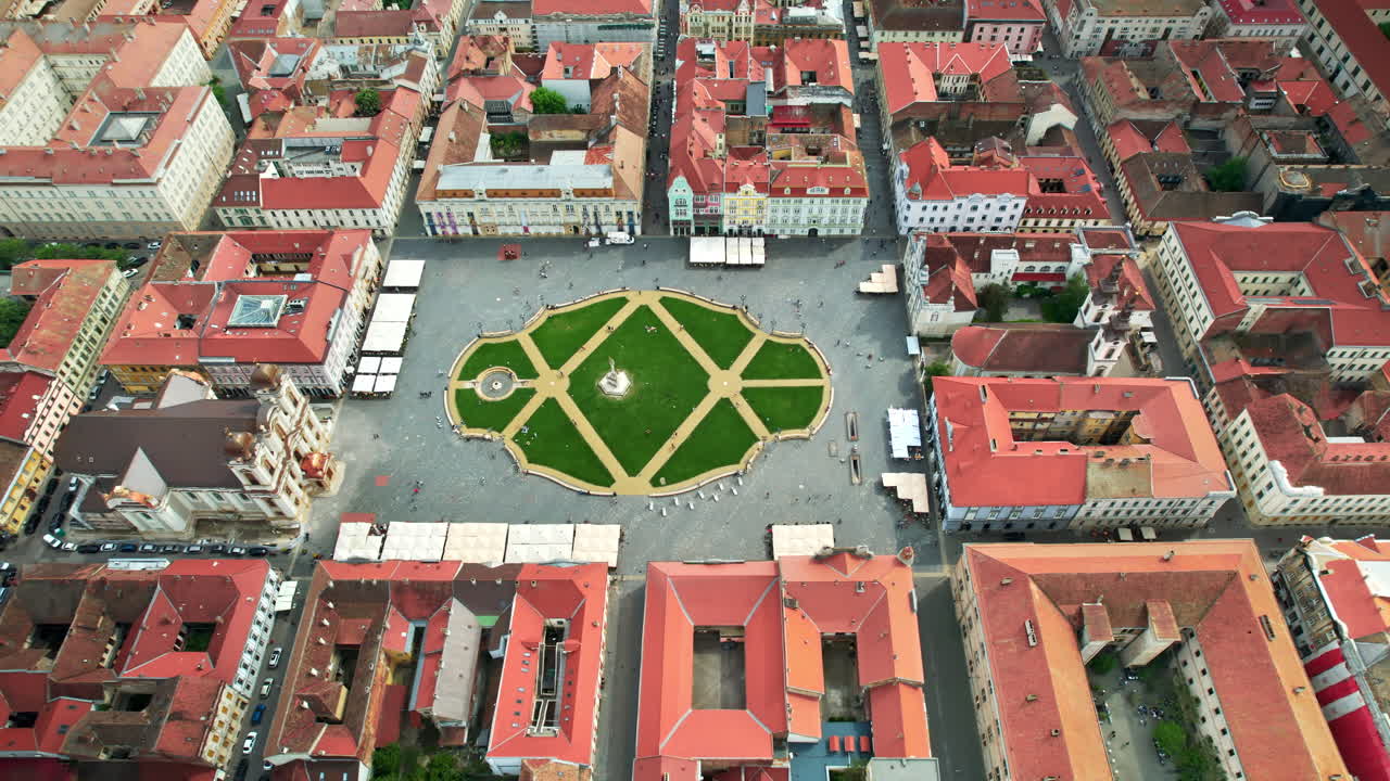 Aerial drone view of Timisoara, Romania. View of the city downtown, Unirii Square with people and multiple historical buildings around