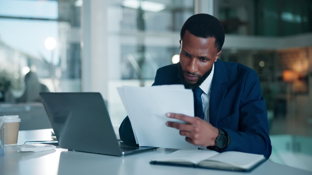 Businessman reviewing documents in the office