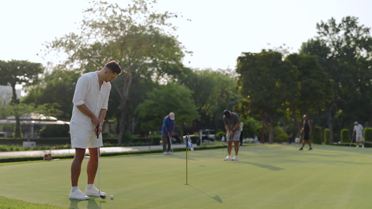 People Playing Golf on a Sunny Day in a Park