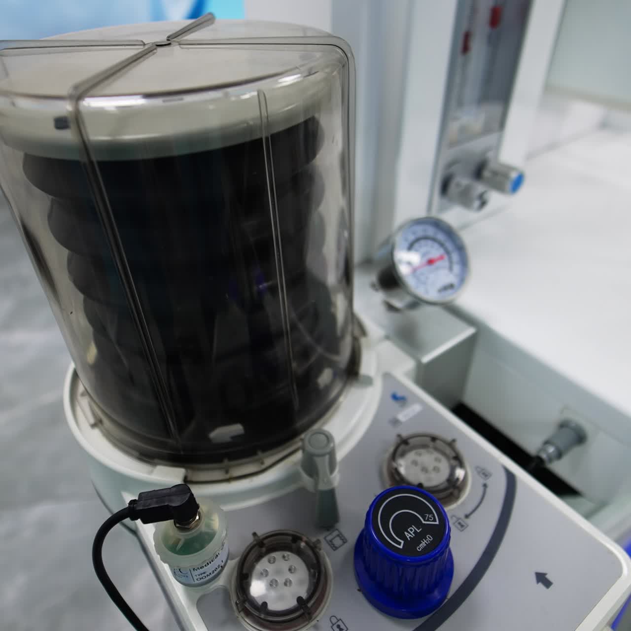 Black pump moving up and down in the apparatus. Equipment for lung ventilation in the surgery theatre. View from above