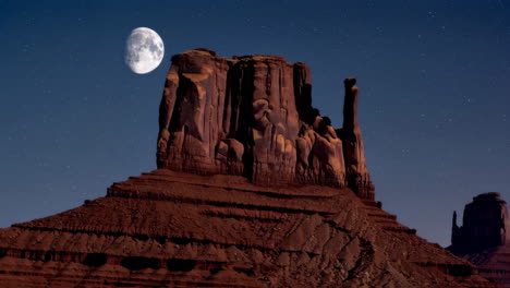 moonlit rock formation in a starry desert night